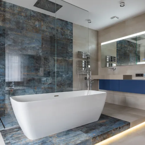 Modern bathroom with a walk-in shower, oak vanity and chrome fittings
