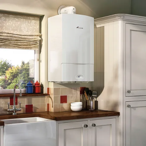 Domestic boiler and plumbing engineer in a kitchen